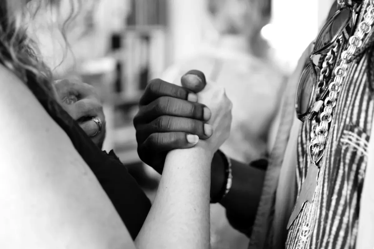 Two people clasping hands