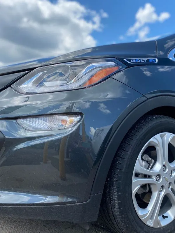 Front of a Chevy Bolt and Clouds