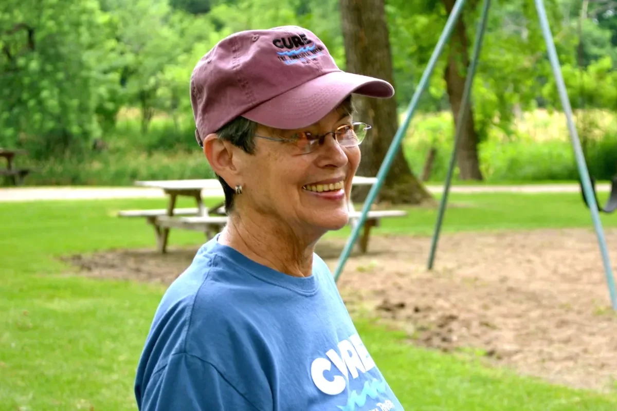Dixie Tilden in CURE Baseball Cap and T-shirt