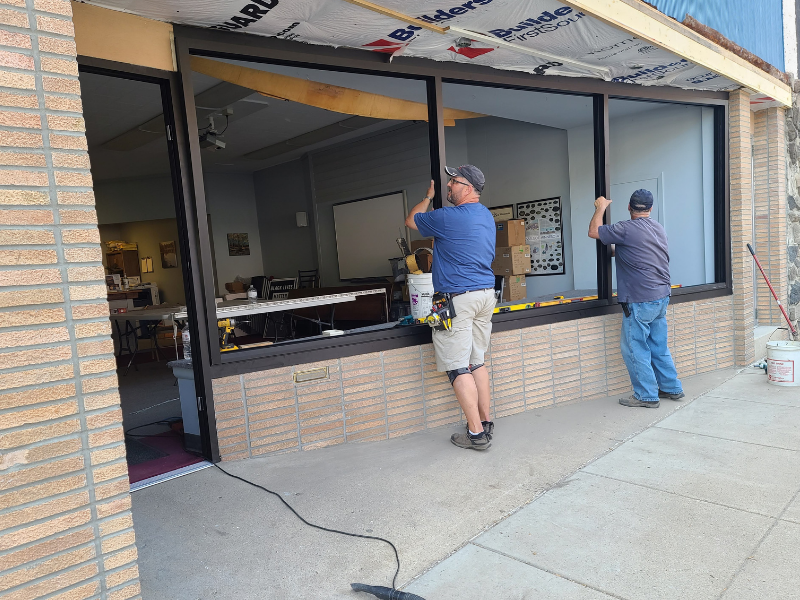The crew from French Glass installing new front windows.