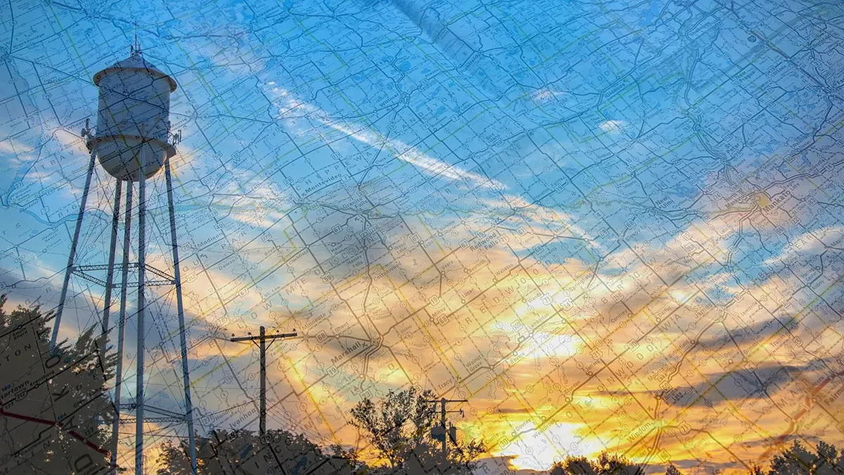 Water tower at sunset with Minnesota map overlay