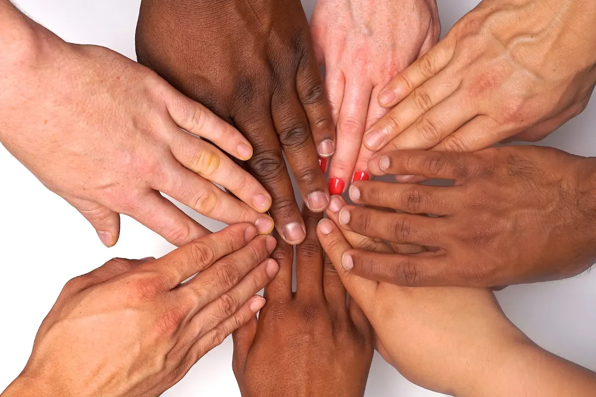 Women's Hands Coming Together