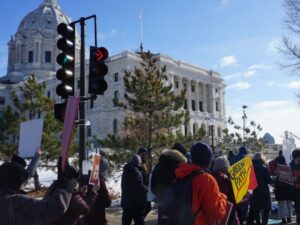 Climate activists marching to the Minnesota State Capitol at the Rise + Repair rally.