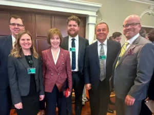 Pete Wyckoff, Assistant Commissioner for Federal & State Energy Initiatives, Minnesota Department of Commerce; Stacy Miller, Board Director, Dakota Electric Association & Minnesota Rural Electric Association Director; Sen. Tina Smith, Minnesota; Erik Hatlestad, Energy Democracy Director, CURE; Greg Ridderbusch, President & CEO, Connexus Energy; and Rob Davis, Public Affairs, Programs & Media Relations, Connexus Energy.