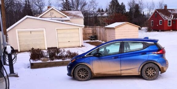 dirty chevy bolt ev in winter in Ely, MB