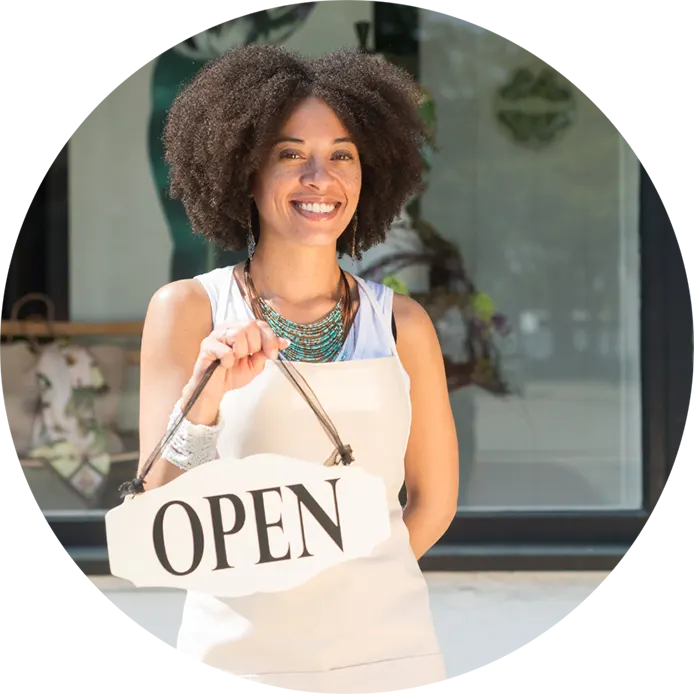 Small business owner holding open sign
