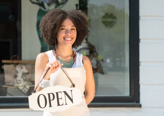 Small Business Owner with Open Sign