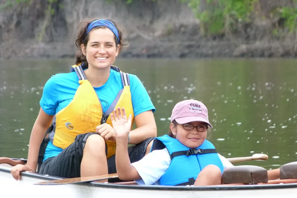 Woman & Child canoeing on a river