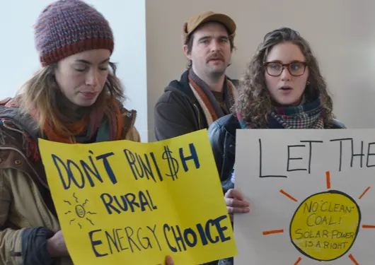 People holding signs