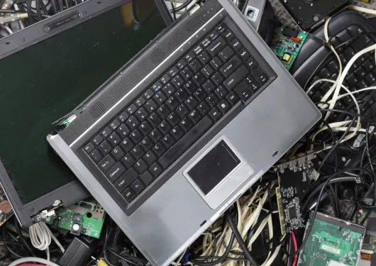electronic waste in a junk pile