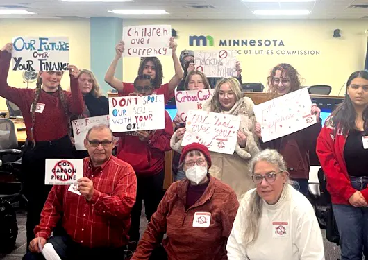 School kids with signs at the Public Utilities Commission