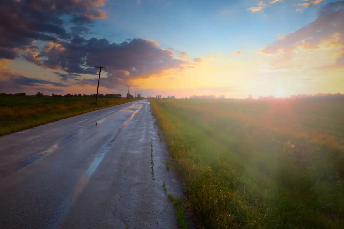 midwestern sunset from a paved road perspective